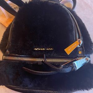 NWT/NBW Michael Kors Rhea Zip XS MSGR Backpack Color Black & Original Dust Bag